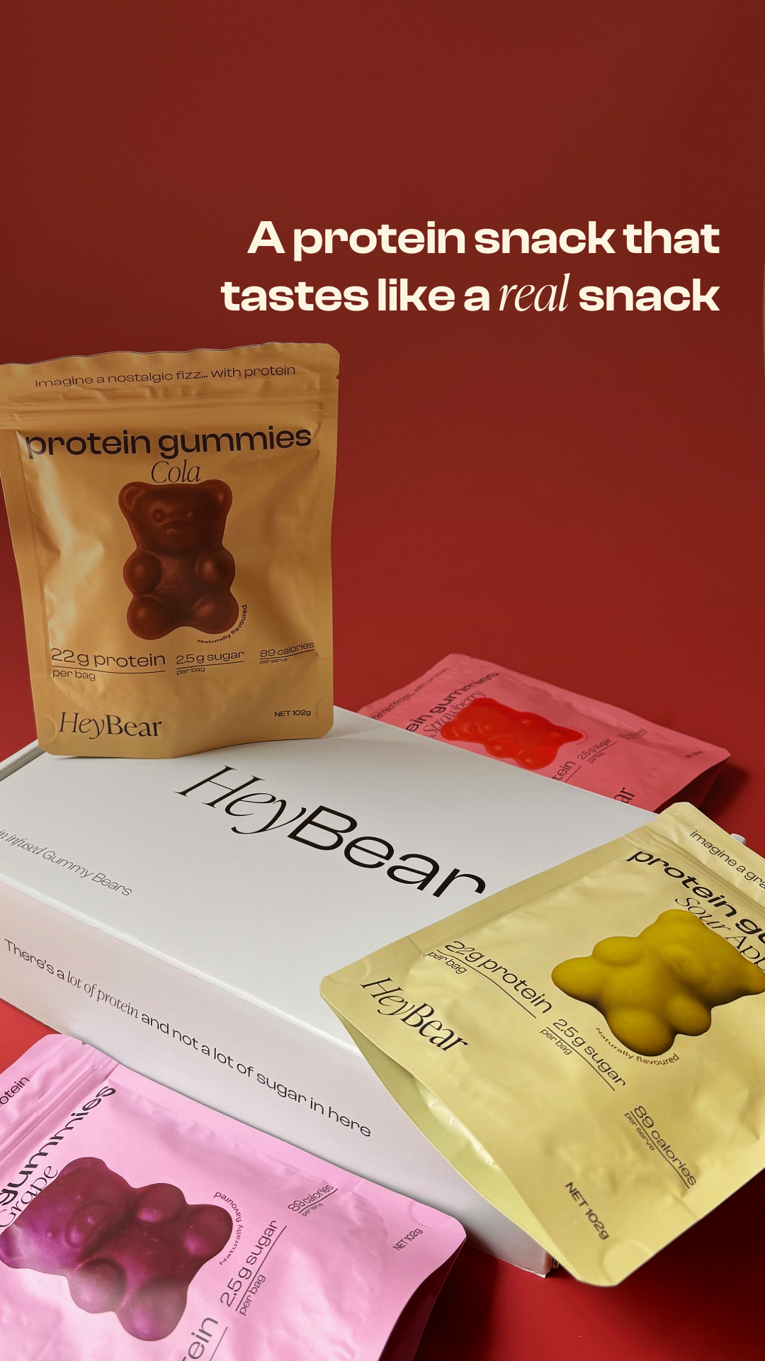 Protein gummies packaging with 'HeyBear' branding on a red background
